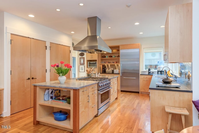 kitchen with light brown cabinetry, built in appliances, open shelves, and island range hood