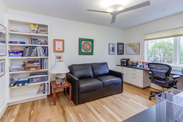 home office featuring a ceiling fan and light wood finished floors