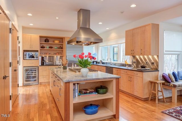 kitchen featuring light brown cabinets, island exhaust hood, and open shelves