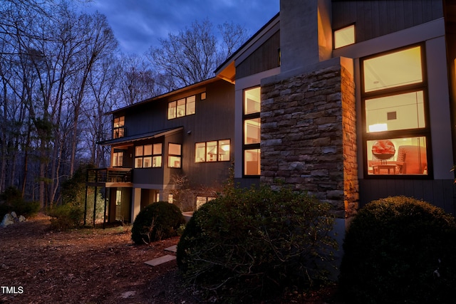 view of side of home featuring stone siding