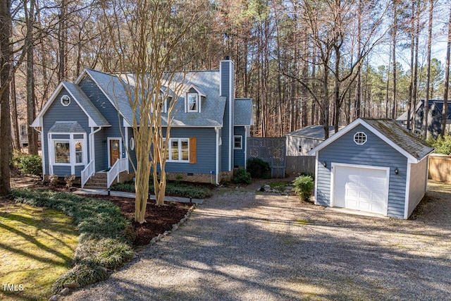 view of front of house with a garage, gravel driveway, an outdoor structure, crawl space, and a chimney