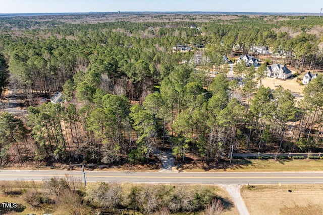 aerial view featuring a forest view