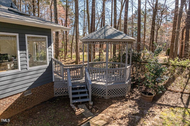 wooden deck featuring a gazebo