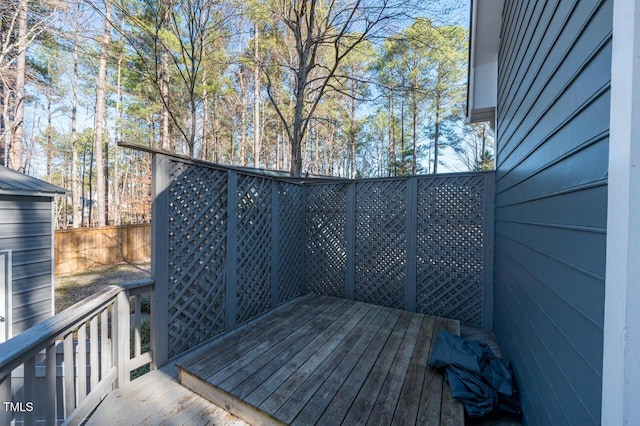 wooden deck featuring fence