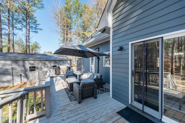 wooden terrace with outdoor lounge area