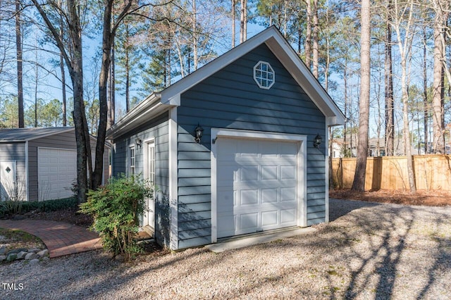 detached garage with fence