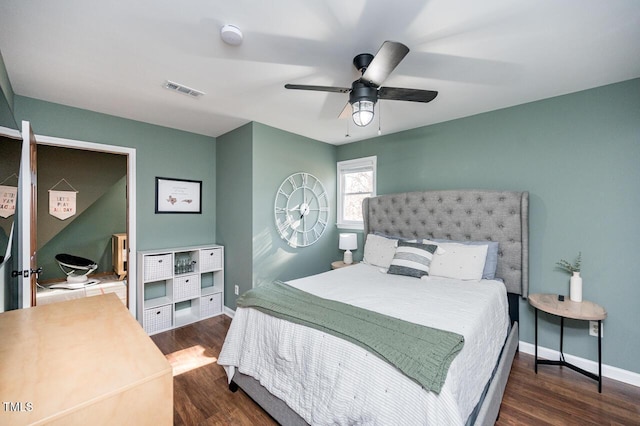 bedroom with ceiling fan, visible vents, baseboards, and wood finished floors