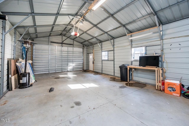 garage with metal wall and a garage door opener