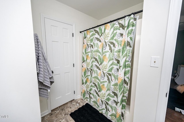 full bath with a shower with shower curtain