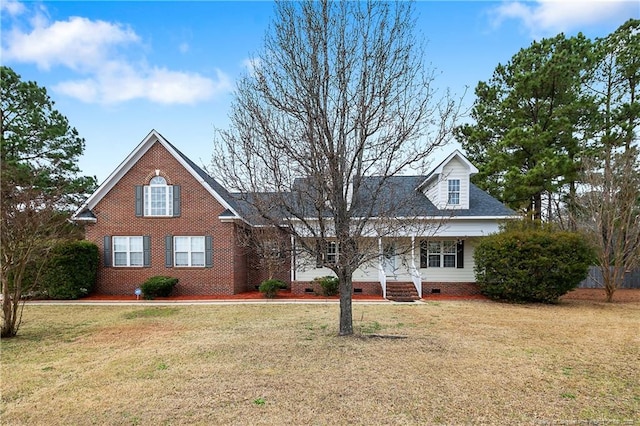 view of front of home featuring crawl space, covered porch, and a front lawn