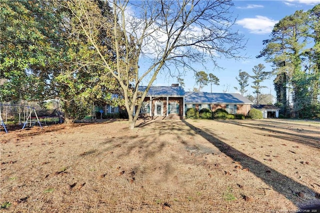 view of front of house with playground community