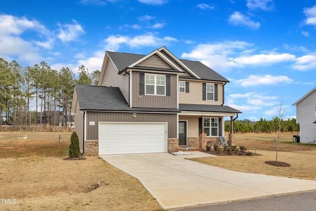 craftsman inspired home featuring concrete driveway, a porch, and brick siding