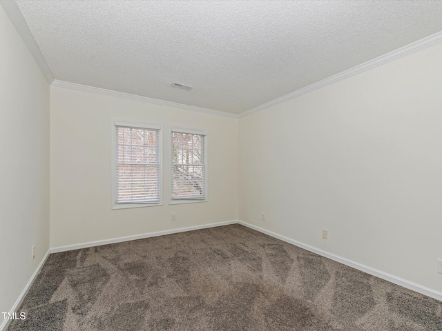 empty room with baseboards, visible vents, ornamental molding, a textured ceiling, and carpet flooring