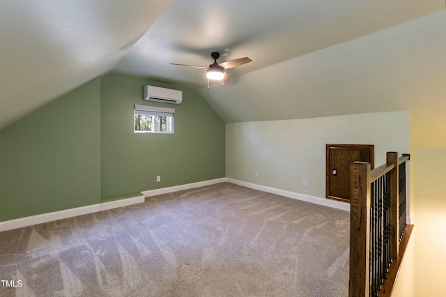 additional living space featuring baseboards, carpet floors, ceiling fan, an AC wall unit, and vaulted ceiling