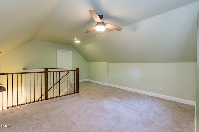 bonus room with carpet flooring, a ceiling fan, baseboards, and vaulted ceiling