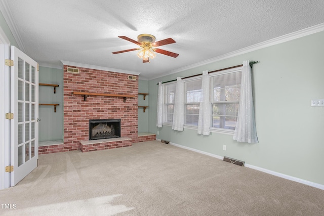 unfurnished living room featuring crown molding, visible vents, and ceiling fan