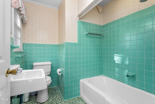 bathroom featuring tile patterned floors, a wainscoted wall, tile walls, and wallpapered walls