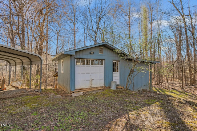 garage featuring a carport