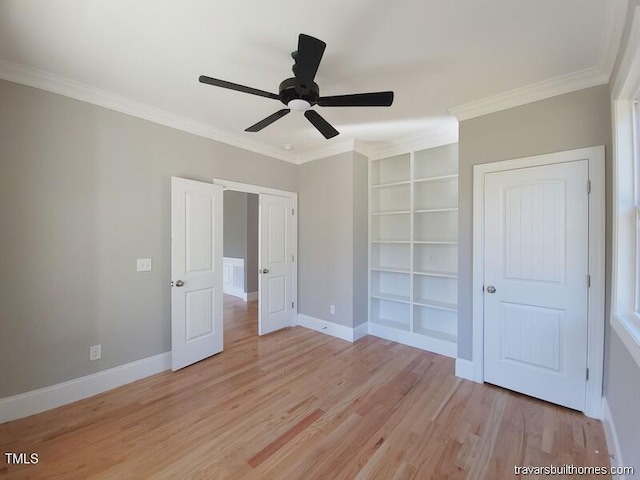 unfurnished bedroom featuring ceiling fan, baseboards, ornamental molding, and light wood finished floors