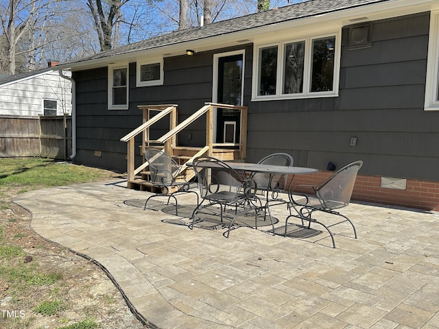 view of patio / terrace featuring outdoor dining area and fence