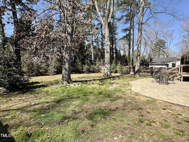 view of yard with a patio and fence