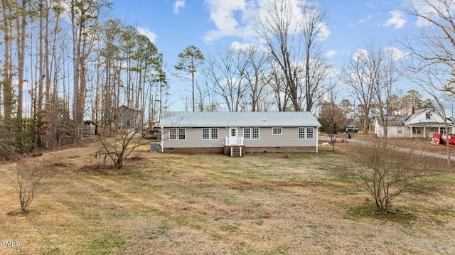 view of front of property with entry steps, a front lawn, cooling unit, and crawl space