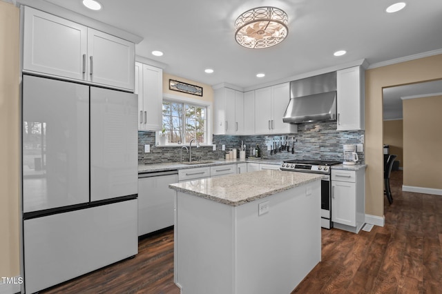 kitchen with electric range, a sink, white fridge, wall chimney exhaust hood, and dishwasher