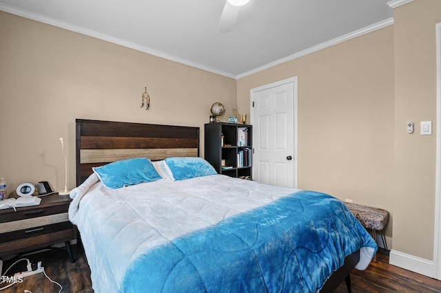 bedroom featuring crown molding, wood finished floors, baseboards, and ceiling fan