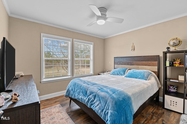 bedroom featuring baseboards, a ceiling fan, wood finished floors, and crown molding