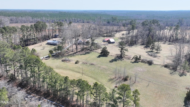 birds eye view of property with a rural view and a view of trees