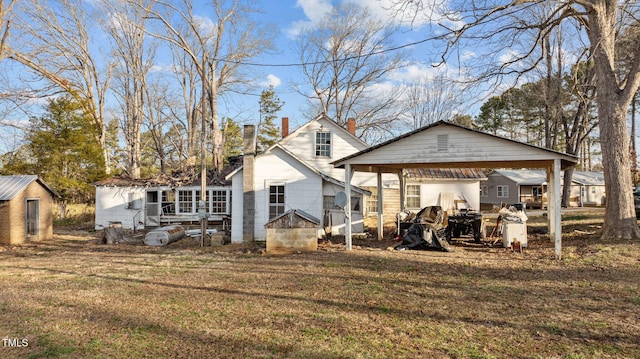 back of property featuring a yard