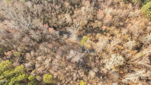 drone / aerial view with a view of trees