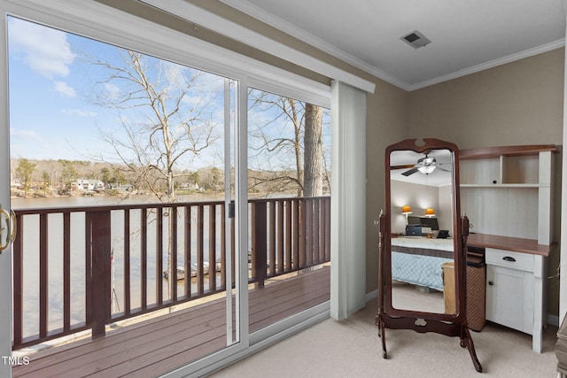 interior space featuring visible vents, access to exterior, and crown molding