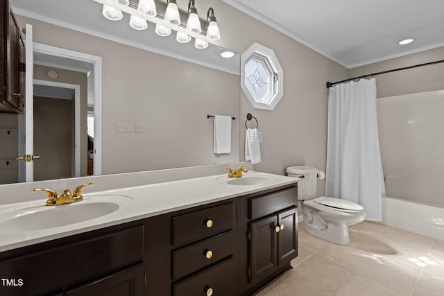 full bathroom with tile patterned floors, double vanity, toilet, and a sink