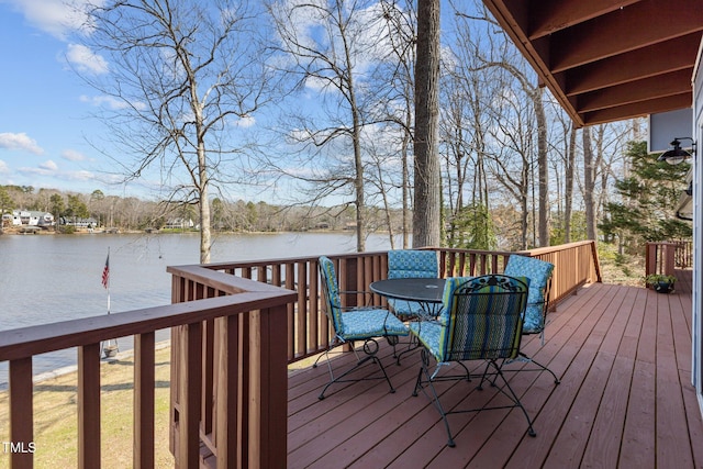 wooden deck featuring a water view