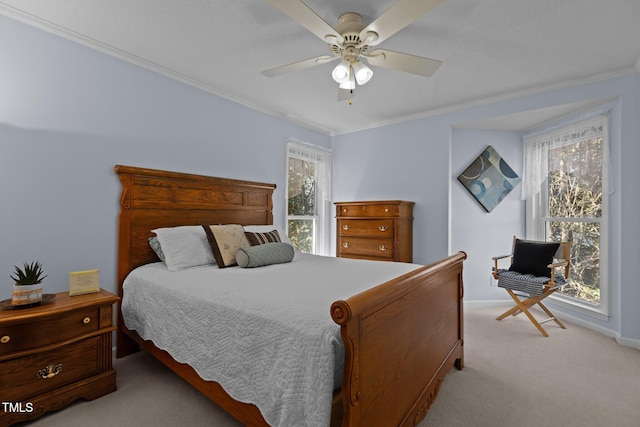 bedroom featuring light colored carpet, baseboards, ceiling fan, and ornamental molding