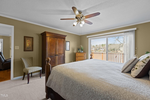 bedroom featuring access to exterior, crown molding, and light colored carpet