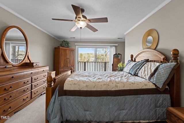 carpeted bedroom featuring a textured ceiling, ornamental molding, a ceiling fan, and access to outside