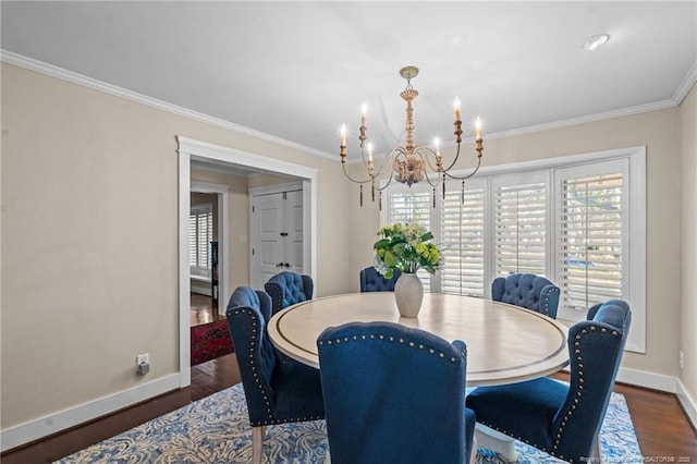 1906 Partridge Dr, Fayetteville, NC 28304 - dining area featuring ornamental molding, baseboards, an inviting chandelier, and wood finished floors
