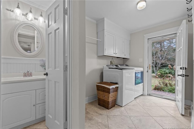 1906 Partridge Dr, Fayetteville, NC 28304 - laundry room with ornamental molding, light tile patterned flooring, cabinet space, independent washer and dryer, and a sink