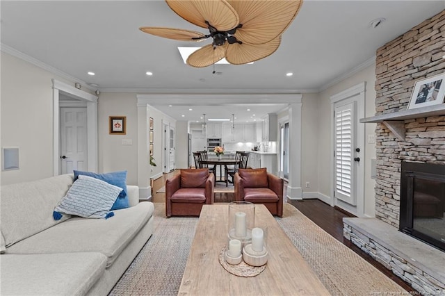 1906 Partridge Dr, Fayetteville, NC 28304 - living room with wood finished floors, crown molding, a fireplace, and baseboards