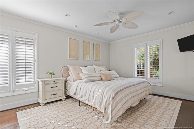 1906 Partridge Dr, Fayetteville, NC 28304 - bedroom with a ceiling fan, wood finished floors, baseboards, visible vents, and crown molding