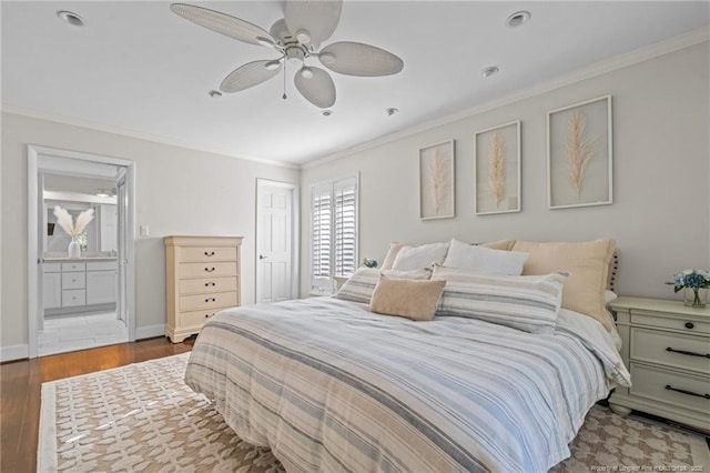 1906 Partridge Dr, Fayetteville, NC 28304 - bedroom with crown molding, baseboards, ensuite bathroom, wood finished floors, and a closet
