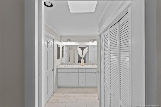 1906 Partridge Dr, Fayetteville, NC 28304 - bathroom with double vanity, a sink, a closet, crown molding, and marble finish floor