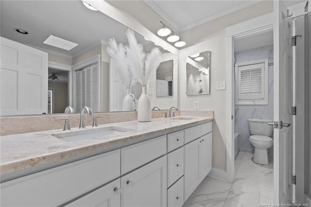 1906 Partridge Dr, Fayetteville, NC 28304 - bathroom featuring double vanity, marble finish floor, crown molding, and a sink