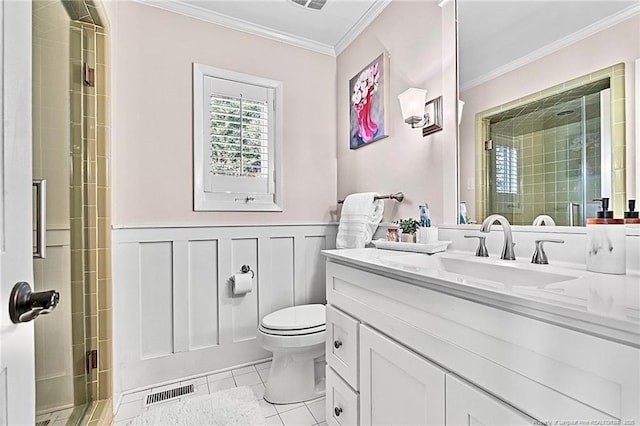 1906 Partridge Dr, Fayetteville, NC 28304 - full bathroom featuring a wainscoted wall, a stall shower, toilet, and crown molding