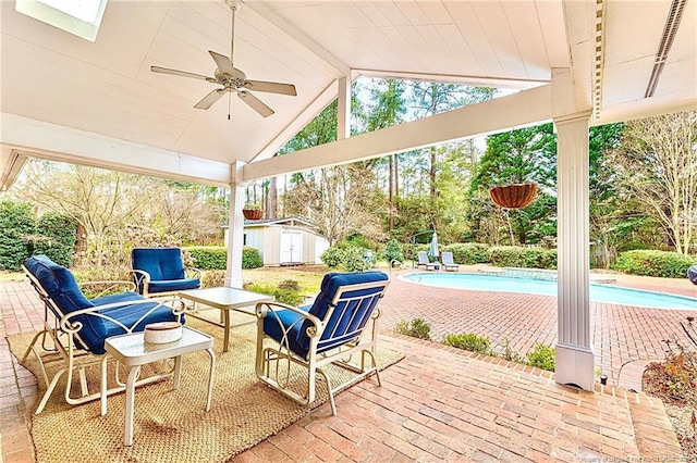 1906 Partridge Dr, Fayetteville, NC 28304 - view of patio featuring an outdoor pool, a storage unit, an outdoor structure, and a ceiling fan