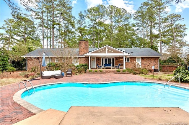 1906 Partridge Dr, Fayetteville, NC 28304 - outdoor pool with outdoor lounge area and a patio