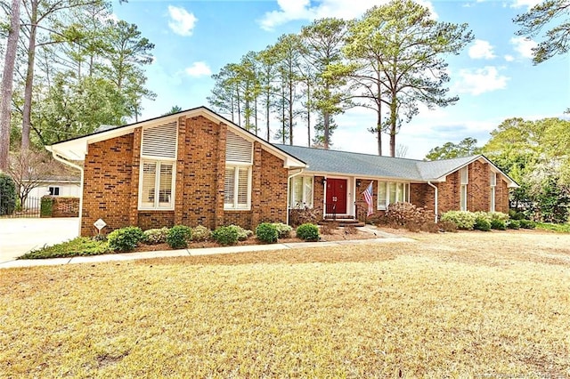 1906 Partridge Dr, Fayetteville, NC 28304 - view of front of house with a front yard and brick siding