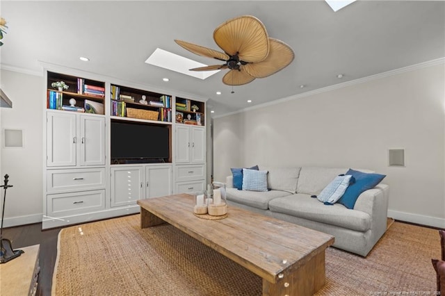 1906 Partridge Dr, Fayetteville, NC 28304 - living room with a skylight, crown molding, wood finished floors, recessed lighting, and a ceiling fan